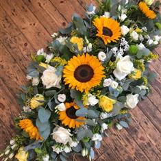 Double ended funeral spray in yellow and white